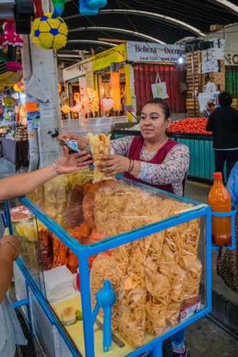 Buying Mexico City Street Food from a vendor